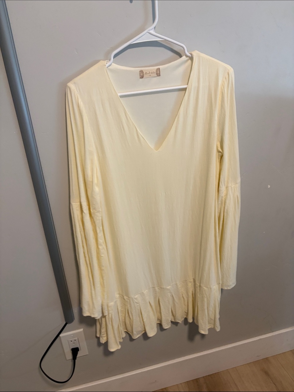 Altar’d State soft butter yellow dress. Flowing sleeves and ruffled edge hem